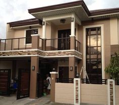 two story house with balcony and balconies