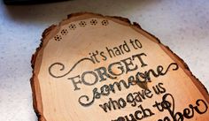 a piece of wood with writing on it that says, it's hard to forget someone