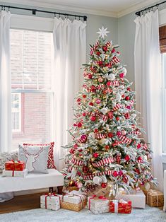 an instagram christmas tree with red and white ornaments