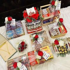 a table topped with lots of different types of gifts and flowers on top of it