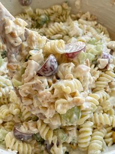 the pasta salad is loaded with chicken and vegetables