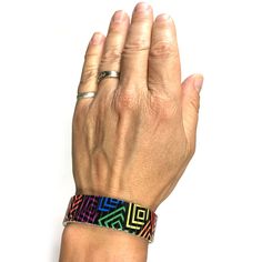 "Stretch bracelet with a rainbow square design. The art is \"baked\" into each bracelet making it very durable. Wrist-Art is made using a comfortable repurposed stainless steel watch band it will never rust and is generally considered hypoallergenic for most people. If you don't see your size in the preset list simply add the size of your wrist in the \"Notes\" section when you place your order. PLEASE NOTE: -The bracelet is more comfortable when it is a bit loose. -It will also stretch easily o Modern Adjustable Multicolor Cuff Bracelet, Adjustable Multicolor Wearable Art Bracelet, Modern Multicolor Jubilee Bracelets, Adjustable Multicolor Beaded Bracelets Wearable Art, Adjustable Multicolor Beaded Bracelets In Wearable Art Style, Adjustable Multicolor Jubilee Cuff Bracelet, Adjustable Multicolor Rectangular Jewelry, Wearable Art Adjustable Multicolor Beaded Bracelets, Artistic Multicolor Adjustable Beaded Bracelets