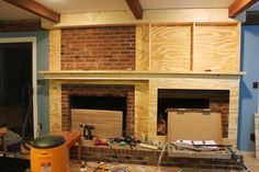 an unfinished fireplace in the middle of a room