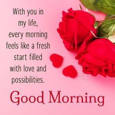 red roses and petals on pink background with good morning message in the bottom right corner