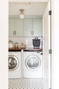 a washer and dryer in a small room