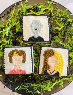 three decorated cookies with the faces of people on them