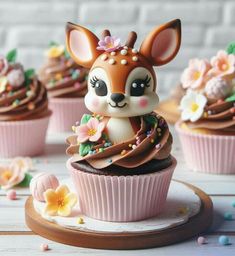 cupcakes decorated with chocolate frosting and flowers