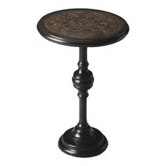 a black table with an ornate design on it's top and bottom, against a white background