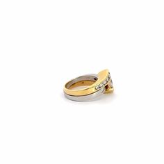 two yellow and white gold wedding rings with diamonds on each side, set against a white background