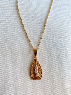 Chain Length: 16", 18", 20" Charm Size: 18x20mm About Gold Filled Jewelry:What is gold-filled? We carry gold filled jewelry that is composed of a solid layer of 18kt gold, that is bonded to a base metal. Gold Filled and vermeil jewelry are great quality alternatives to solid gold. With proper care and storage, you will have jewelry that will last a lifetime. Tips to make your jewelry last:1. Keep it dry. Store your jewelry in the plastic bag included in your purchase.2. Avoid harsh chemicals such as perfume, hairspray, lotions and oils.3. Never use abrasive products to clean your jewelry. Lady Of Guadalupe Necklace, Guadalupe Necklace, Virgin Mary Necklace, Virgin Of Guadalupe, Herringbone Necklace, Our Lady Of Guadalupe, Gold Filled Necklace, Gold Anklet, Lady Of Guadalupe