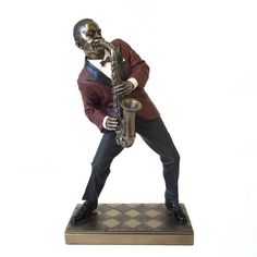 a statue of a man playing a saxophone