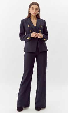 This bold blazer is adorned with gold buttons on the bodice and sleeves. The double-breasted structure also features faux, front pockets and a notched lapel. Can be matched with Colson Trousers. Blazer Double-Breasted Lined Length: 26" Chest: 17 1/4" Self: 77% Polyester, 16% Viscose, 7% Spandex Lining: 97% Polyester, 3% Spandex Hand wash in cold water with similar colors. Model is wearing a size small Style #: G247J1755 Knit Swimwear, Dark Ink, Colour Matching, Comfortable Pants, Sweater Jumpsuit, Ink Blue, Short Dresses Casual, Blazer And Shorts, Blue Colour