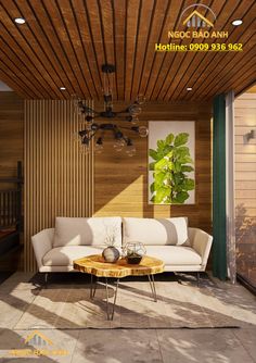 a living room with wood paneling and white couches in front of a wooden ceiling