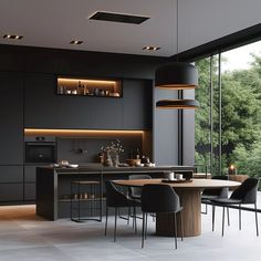 a modern kitchen with an island and dining table