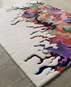 a multicolored area rug on the floor