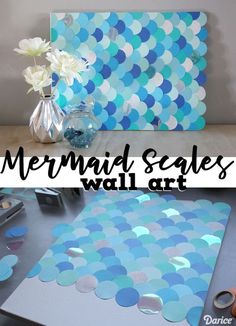 the mermaid scales wall art is displayed on a table with scissors and other crafting supplies