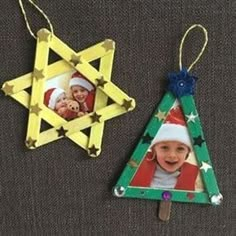 two christmas ornaments are hanging on the wall next to an ornament with a star