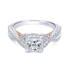 an engagement ring with a princess cut diamond surrounded by pave diamonds and rose gold accents