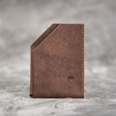 Slim and compact card holder for your cards and folded bills. This minimalistic card holder is made from vegetable tanned Italian Badalassi Carlo Pueblo leather.  It features a premium matte finish and will patina beautifully overtime.  Dimension 9x7cm / 3.54x2.75in  There are 2 pockets, main slot can hold up to 5-6 cards, other half opening slot is for folded dollar bill, but also can be used for cards. Card holder is stitched by hand with strong braided waxed polyester thread. Cheap Handmade Brown Card Holder, Versatile Leather Card Holder, Artisan Leather Rectangular Card Holder, Main Slot, Modern Leather Compact Card Holder, Artisan Leather Card Holder With Card Slots, Brown Leather-lined Card Holder For Daily Use, Other Half, Dollar Bill