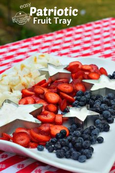 patriotic fruit tray with blueberries, strawberries, and cauliflower on it