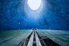 This Blue Cooling Tower lies within an abandoned industrial wasteland in Poland, among the remnants of an old powerplant.