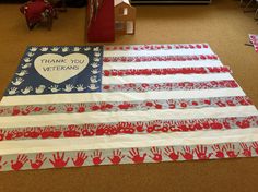 an american flag made out of handprints with thank you veterans written on it