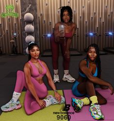 three women in sports wear sitting on yoga mats