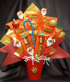 a red vase filled with candy and candies