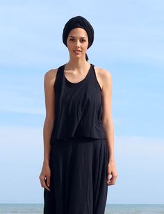 Style - The Racerback is a basic scoop neckline in front with a highly functional t-shaped back. Shape - The Wanderer shape opens at the armpit into a full-bodied, flowy A-line design. Size - Order based on BUST measurement Fabric Shown - Tissue Hemp/Organic Cotton Knit Color Shown - Midnight, Raincloud Fitted Summer Top With Cowl Back, Fitted Top With Cowl Back For Summer, Fitted Cowl Back Tank Top For Summer, Spring Stretch Tops With Cowl Back, Scoop Neck Stretch Top For Daywear, Stretch Scoop Neck Top For Daywear, Versatile Tops With Built-in Bra And Scoop Neck, Black Scoop Back Top For Summer, Yoga Top With Built-in Bra And Scoop Back