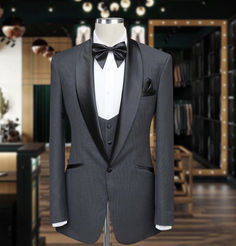 Meticulously handcrafted by our skilled artisans, this tuxedo suit is a testament to our commitment to exceptional craftsmanship. The sleek grey fabric exudes understated charm, providing the perfect canvas for the satin shawl lapel, which adds a touch of luxurious sophistication. Designed with a tailored fit, this three-piece tuxedo suit accentuates your physique and exudes confidence. Gray Notch Lapel Tuxedo For Formal Occasions, Gray Notch Lapel Tuxedo For Formal Events, Gray Tuxedo Suit For Formal Occasions, Tailored Gray Tuxedo For Formal Occasions, Gray Tailored Tuxedo Suit, Gray Tuxedo With Suit Collar For Wedding, Gray Collared Tuxedo For Wedding, Gray Tuxedo For Wedding, Gray Fitted Tuxedo For Formal Occasions