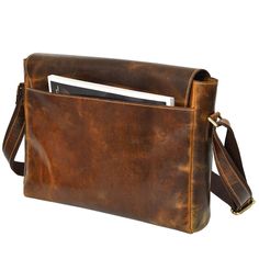 This brown satchel messenger bag, made from genuine leather, combines vintage charm with modern functionality. With ample space and an adjustable strap, it's a stylish and durable companion for any adventure. Distressed Brown Leather-lined Satchel Shoulder Bag, Vintage Brown Bag With Detachable Strap For Everyday Use, Distressed Brown Crossbody Shoulder Bag For Travel, Classic Brown Satchel With Waxed Finish, Distressed Brown Waxed Satchel Bag, Distressed Brown Waxed Finish Shoulder Bag, Brown Satchel Laptop Bag For Everyday Carry, Brown Satchel Laptop Bag For Everyday, Vintage Brown Satchel Briefcase For Everyday