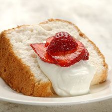 a piece of bread with cream and strawberries on top