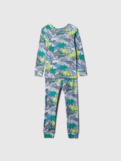 Soft cotton pajama top and pants set.  Crewneck.  Long sleeves.  Elasticized waist at PJ pants.  Allover dinosaur print.  Made with 100% organically grown cotton, which is better for people and the environment because it's grown without the use of harmful synthetic pesticides and fertilizers.  This product was made in a factory that invests in gender equality and women’s empowerment.  Through RISE Reimagining Industry to Support Equality) and Gap Inc. ’s program P. A. C. E.  Personal Advancement Toddler Jeans, Kid Clothes, Which Is Better, Gender Equality, Top And Pants Set, Support People, Pj Pants, Sleepwear & Loungewear, Cotton Pyjamas