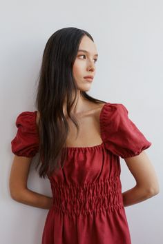 "HOLIDAY is an elegant puff short sleeve linen midi dress.  DETAILS - Puff short sleeve - Elasticated body - Midi length - Oeko-Tex certified 100% local washed midweight linen - Cut and sewn to order just for you in our studio COLOR - Raspberry, you can also choose other colors above - Fabric samples are available here https://www.etsy.com/listing/586569696/linen-fabric-samples SIZING & FIT - Fit true to size - Model is 5'9.5\" / 177cm and wearing a size XS CARE FOR LINEN - Machine wash up to 30ºC/86ºF gentle cycle - Lay flat to dry or tumble dry low - Warm iron if needed - Do not bleach SIZE GUIDE Size conversion guide Size XS (US 0-2, IT 36-38, UK 4-6, Japan 3-5, France 32-34) Size S (US 4-6, IT 40-42, UK 8-10, Japan 7-9, France 36-38) Size M (US 8-10, IT 44-46, UK 12-14, Japan 11-13, Fr Summer Ruched Puff Sleeve Top With Square Neck, Solid Color Summer Puff Sleeve Top, Summer Smocked Bodice Puff Sleeve Top, Puff Sleeve Dress With Gathered Short Sleeves, Summer Puff Sleeve Top With Smocked Bodice, Cotton Puff Sleeve Top For Brunch, Summer Puff Sleeve Top For Daywear, Summer Short Sleeve Puff Top, Short Sleeve Puff Top For Summer Daywear