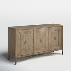 This sideboard delivers a touch of farmhouse charm and a whole lot of storage to your dining room. Its weathered solid and engineered wood construction contrasts with the bronze-finished base and ring pulls for subtle visual interest. Three cabinet doors with picture-frame paneling open to reveal plenty of interior space to store dinnerware and table linens. Plus, the top is just right for displaying décor or rolling out a buffet. Comes with a wall anchor for extra stability. Birch Lane™ Birch L Ring Pulls, Wide Sideboard, Blanket Basket, Kitchen Sideboard, Curtain Hardware, Wall Anchors, Decor Display, Sideboard Buffet, Birch Lane