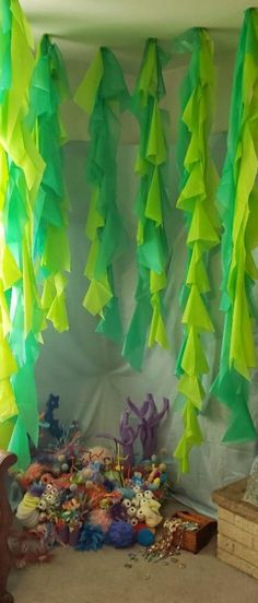 the room is decorated with green and yellow streamers