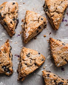 blueberry scones are arranged on a baking sheet