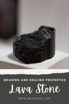 a piece of black lava stone sitting on top of a white plate with text overlay