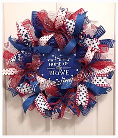 a red, white and blue wreath with the words home of the brave on it