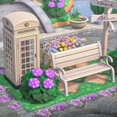 a wooden bench sitting in front of a flower bed and a phone booth on the side walk