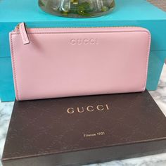 This Is A Gorgeous, Soft Pink Leather Wallet. It Zips Around On 2 Sides, With One Side Remaining Open. Very Cute Design. This Was A Boutique/Retail Wallet; Not Found In Outlets. Approximately Measures 7.5” X 4” X 1” 8 Credit Card Slots, Zipped Coin Pouch, And Multiple Bill Folds Comes With A Gucci Box, Care Cards, And I’ve Taken A Picture Of The Unique Gucci Serial Number. Gucci Box, Coin Pouch, Cute Design, Pink Leather, Gucci Bag, Cute Designs, Soft Pink, Leather Wallet, Card Slots