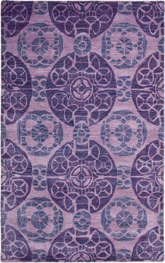 a purple rug with an intricate design on the front and back side, in various colors