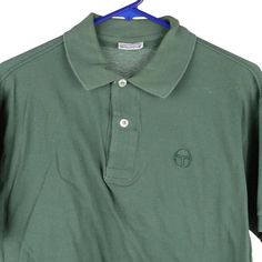 Description:Vintage green Sergio Tacchini polo shirt, fits large.GENDER: womens CONDITION: good - small stains on front. STYLE: polo shirtERA: 1990sCOLOUR: greenFABRIC: cotton blend Classic Green Collared T-shirt, Retro Green Short Sleeve Polo Shirt, Classic Green Shirt With Polo Collar, Vintage Green Short Sleeve Polo Shirt, Casual Green Polo Collar Shirt, Casual Green Polo Shirt, Green Cotton Polo Shirt With Collared Neckline, Vintage Green Polo Shirt With Polo Collar, Retro Green Collared T-shirt