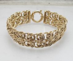 Polished Bold Double Eight Infinity  Link Bracelet Real 14K Yellow Gold     Metal Condition Finish Avg. Weight Width Length Clasp Type Retail Price Real 14K Yellow Gold (Stamped 14K)  Brand New Polished 11.80 grams 16.3mm ~ 5/8" 7" Spring Ring Clasp $2124 Gold Infinity Jubilee Bracelet, Handmade Yellow Gold Bracelet For Anniversary, Gold Sign, Fine Jewelry Bracelets, Wrapped Jewelry, Wire Wrapped Jewelry, Spring Rings, Link Bracelets, Wire Wrapped