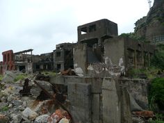 an old building that has been destroyed and is sitting on the side of a hill