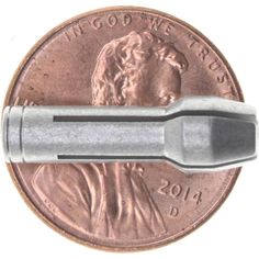 a close up of a penny with a screwdriver on it's side