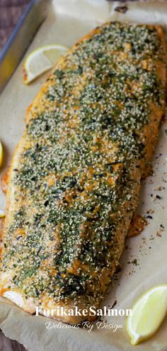 the fish is covered with herbs and lemons