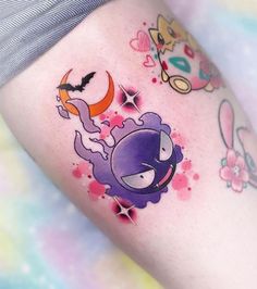 an image of a cartoon character tattoo on someone's leg with watercolors