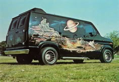 a van with an image of saturn painted on it