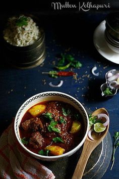 a bowl filled with meat and vegetables on top of a table